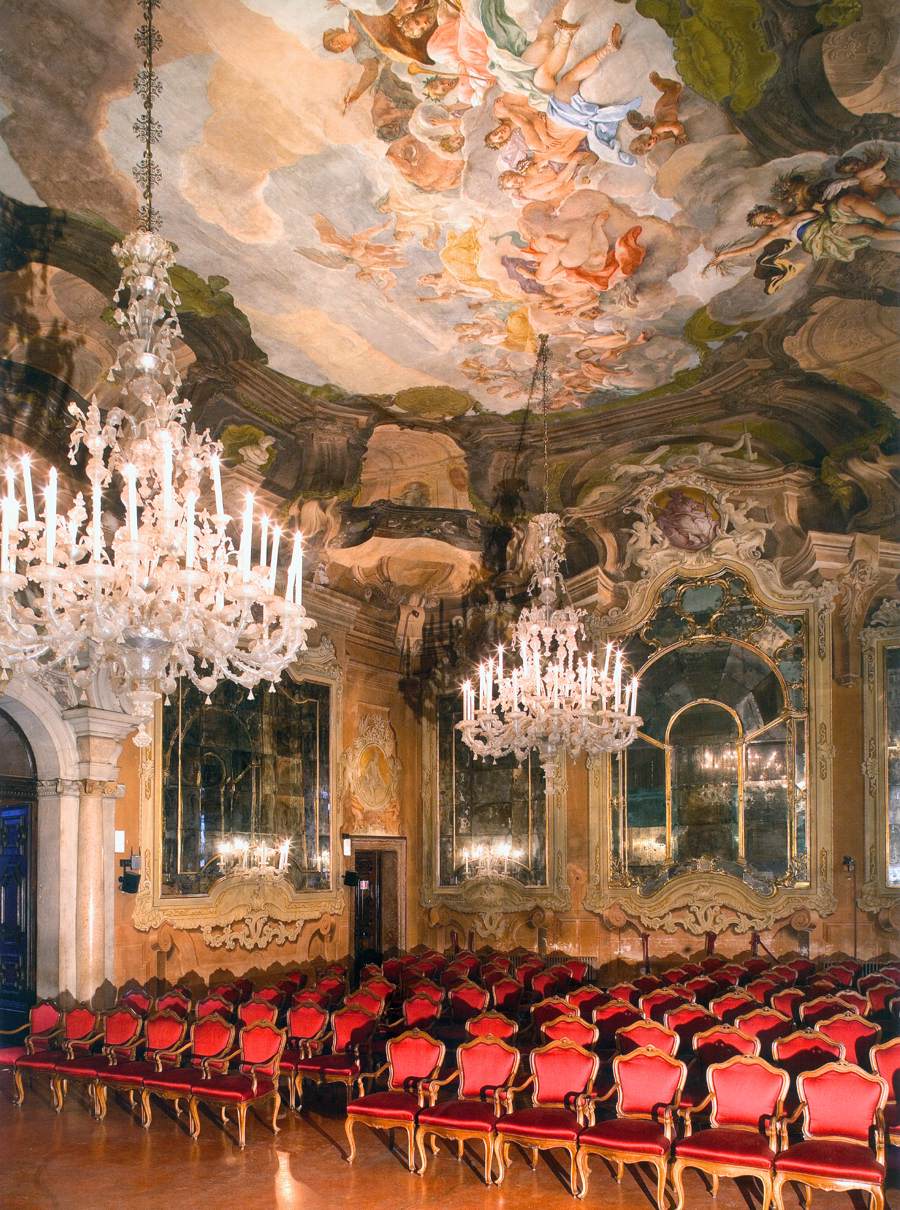 Interior of Aula Magna Silvio Trentin at Ca’ Dolfin, with frescoed walls and ceiling.